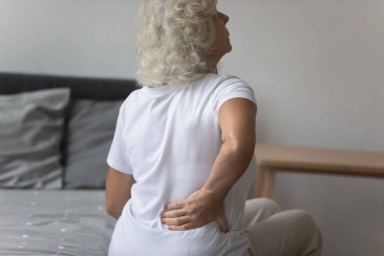 Old woman having a back pain need the treatment of stem cell therapy in Las Vegas, Nevada at Dynamic Stem Cell