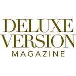 The image displays the "Deluxe Version Magazine" logo in gold, serif capital letters on a white background. The image displays the "Deluxe Version Magazine" logo in gold, serif capital letters on a white background.